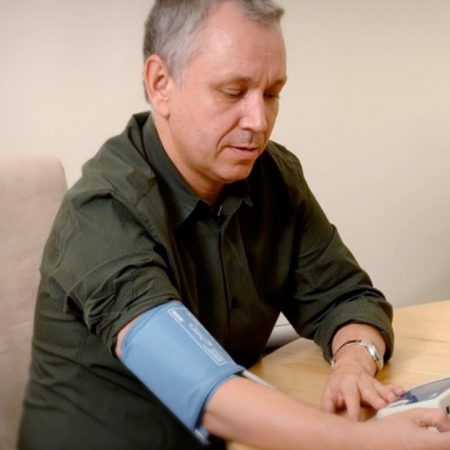 Male testing blood pressure using Medly App