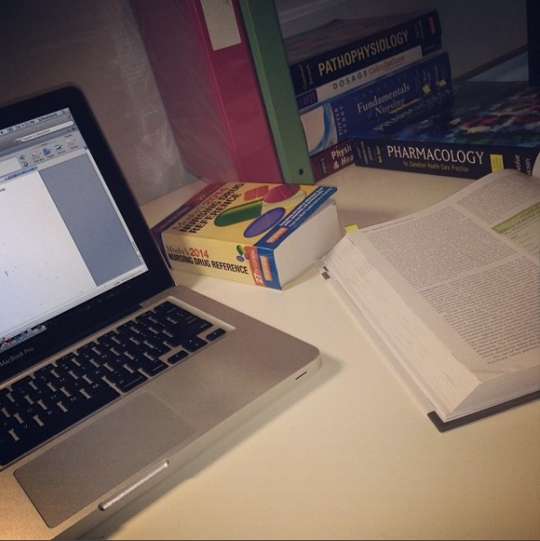 Desk and laptop with textbooks