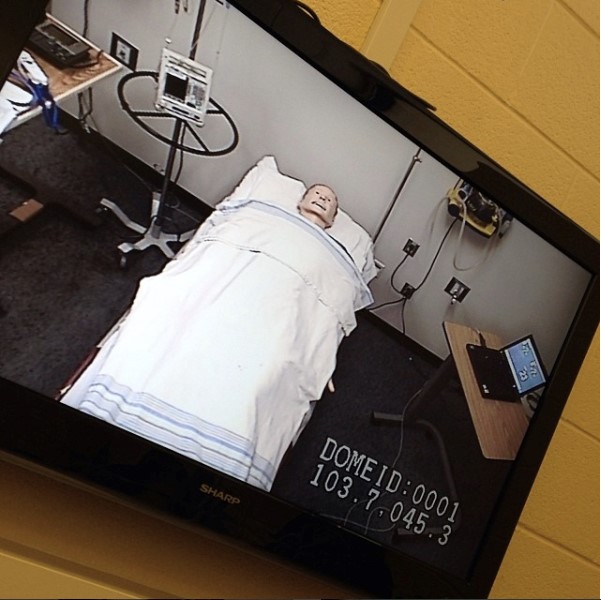 Robotic patient on bed for nursing simulation