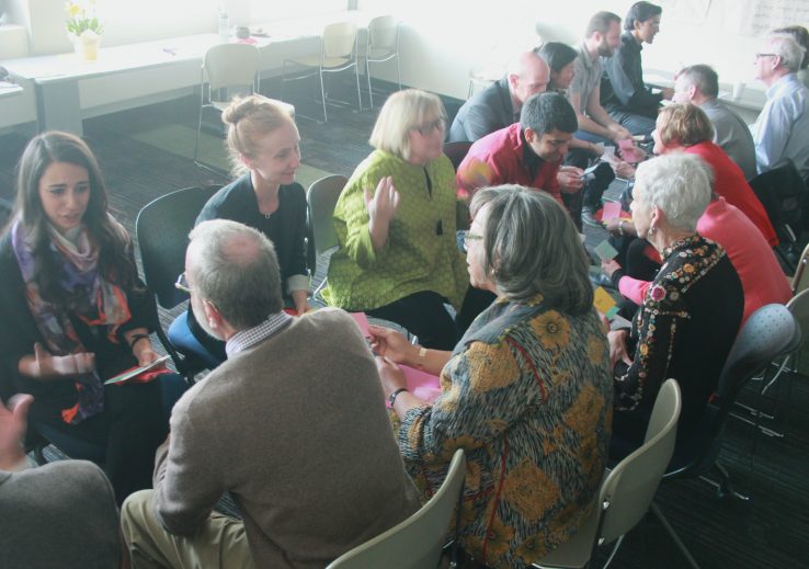 emerging and experienced leaders sit in two rows to partake in discussion