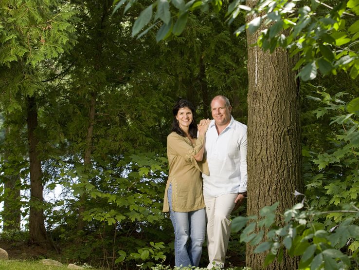 Profile of Paul and Alessandra Dalla Lana with trees and foliage in the background