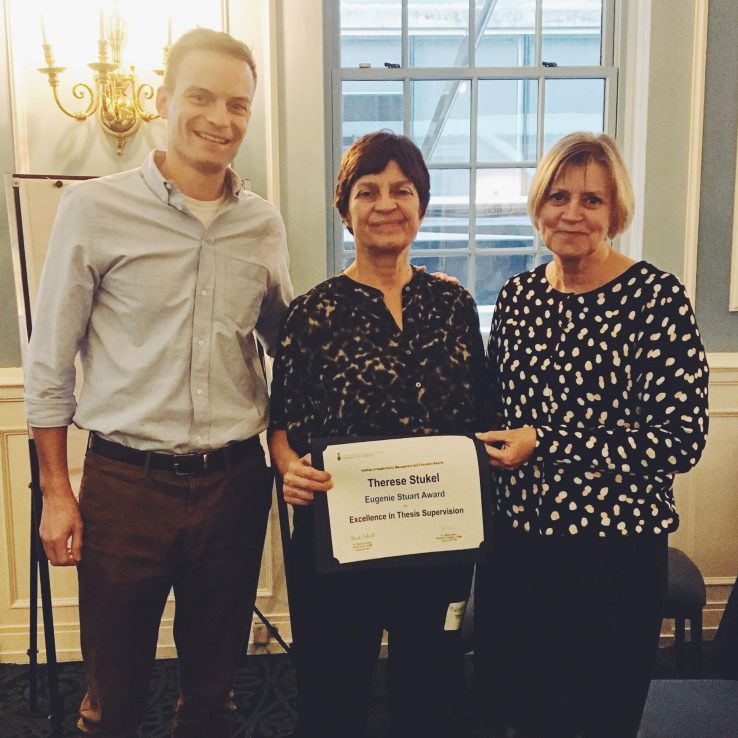 Kieran Quinn (l) with Therese Stukel, and Interim Director Rhonda Cockerill