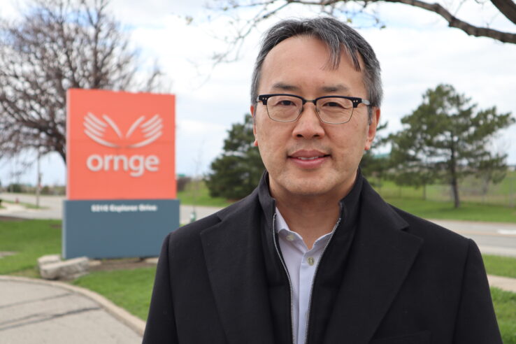Homer Tien in from of Ornge head office.