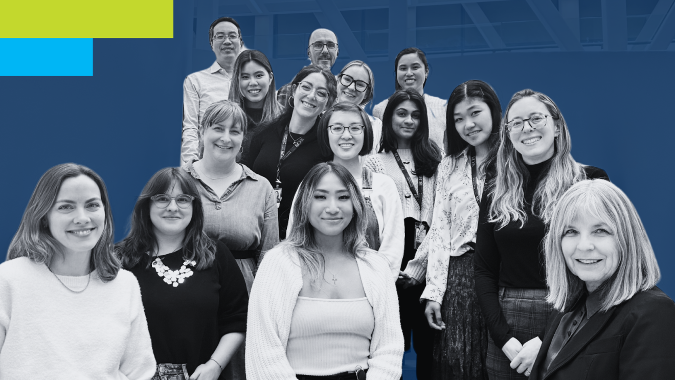 "Group photo of a diverse team of professionals smiling together against a modern blue backdrop, showcasing camaraderie and teamwork."