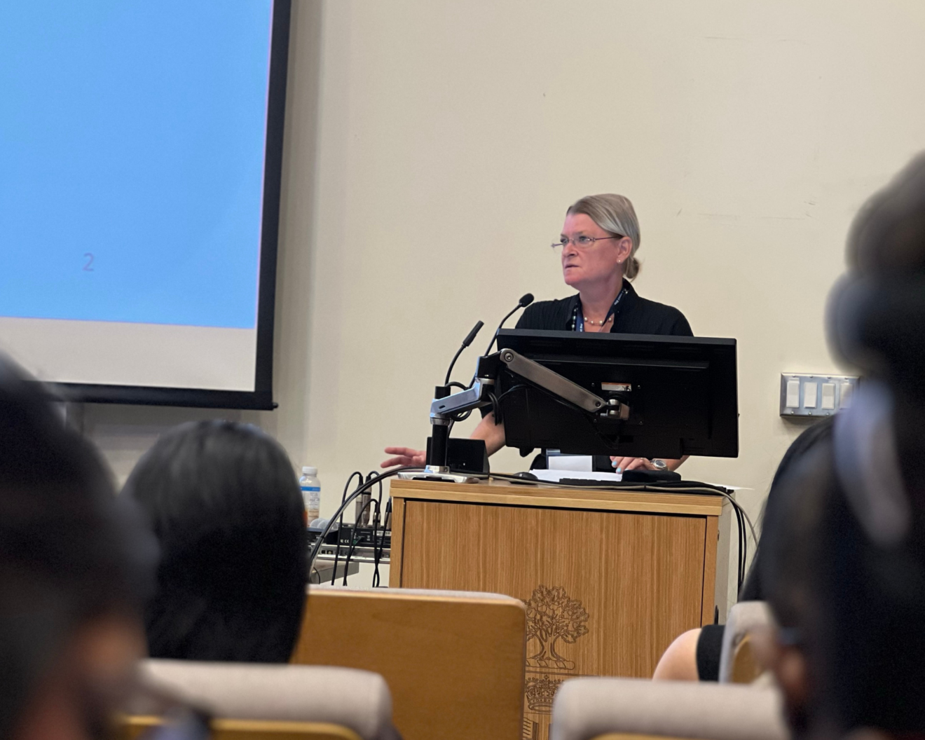 Dr. Lianne Jeffs, the keynote speaker for the 21st Annual Research and Impact Day, speaking at a podium at the front of a room of people.